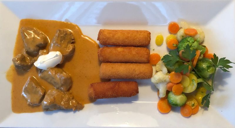 Sliced meat in sauce with croquettes – Bludenz