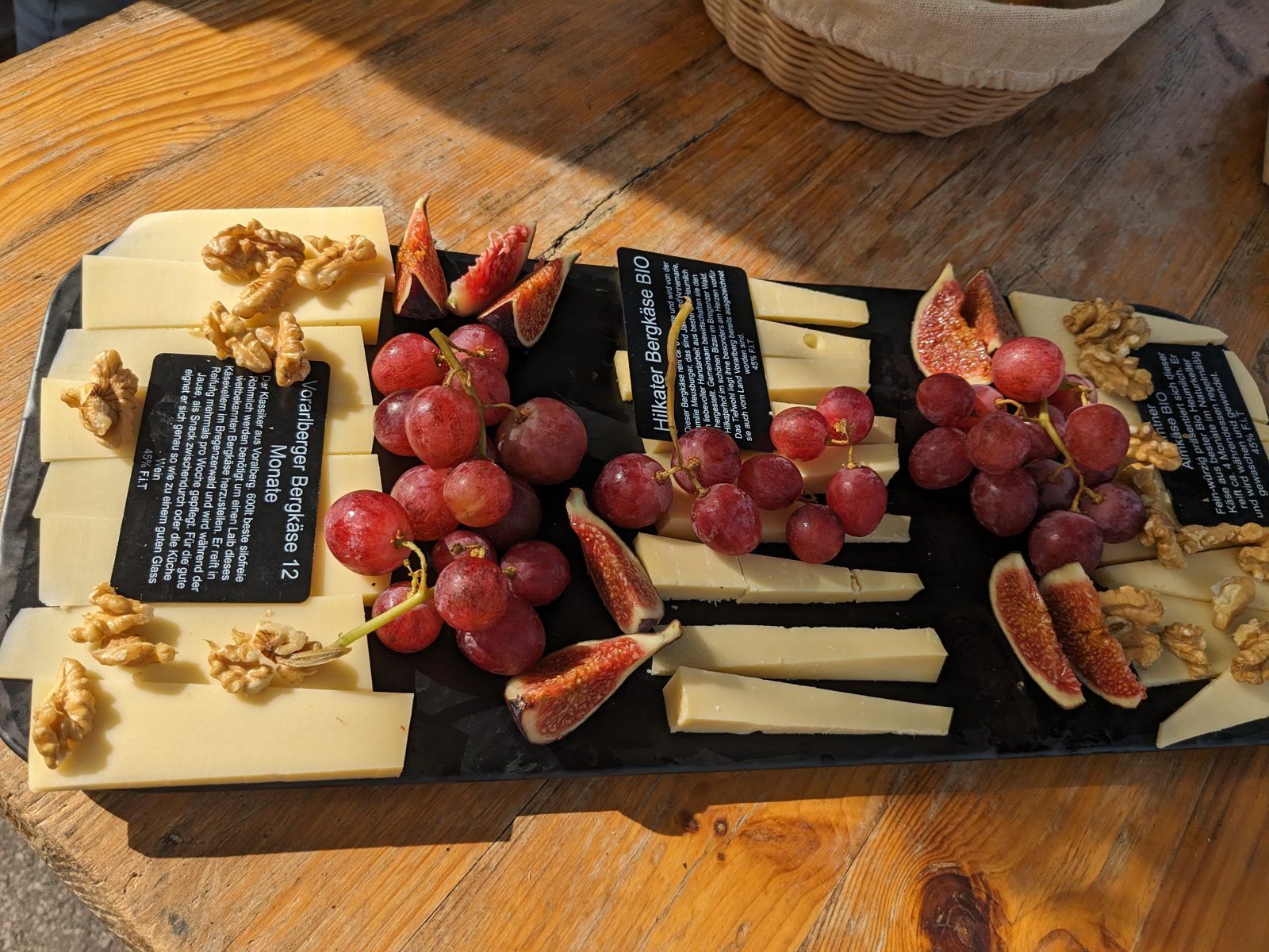Cheese platter with figs and grapes